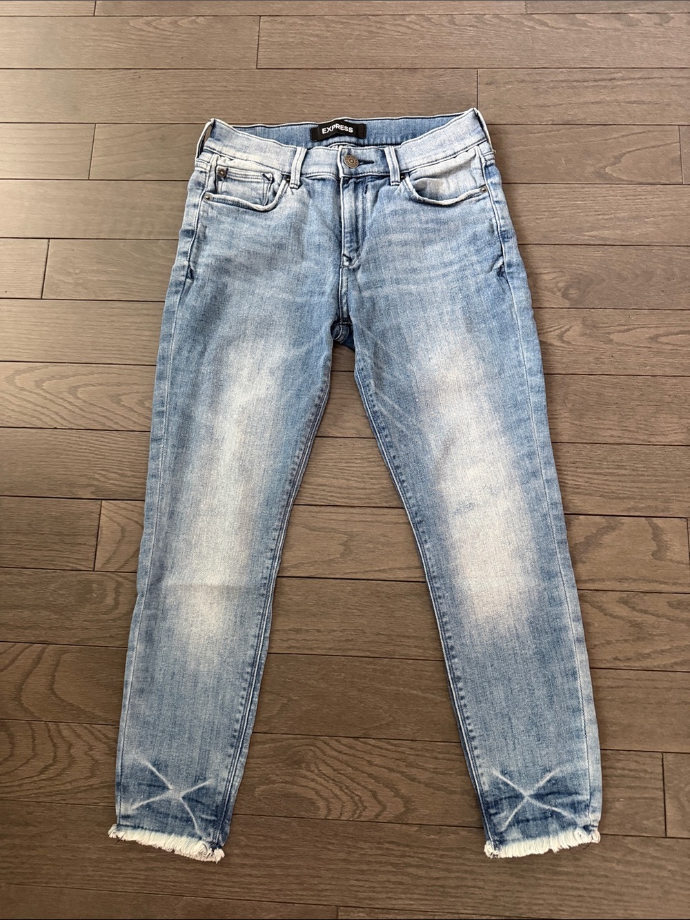 Express Light Blue Faded Skinny Jeans with Frayed Ankles